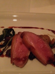  Roasted Moulard Duck Breast  with sautéed dandelion greens,bing cherries and muscat jus paired 
