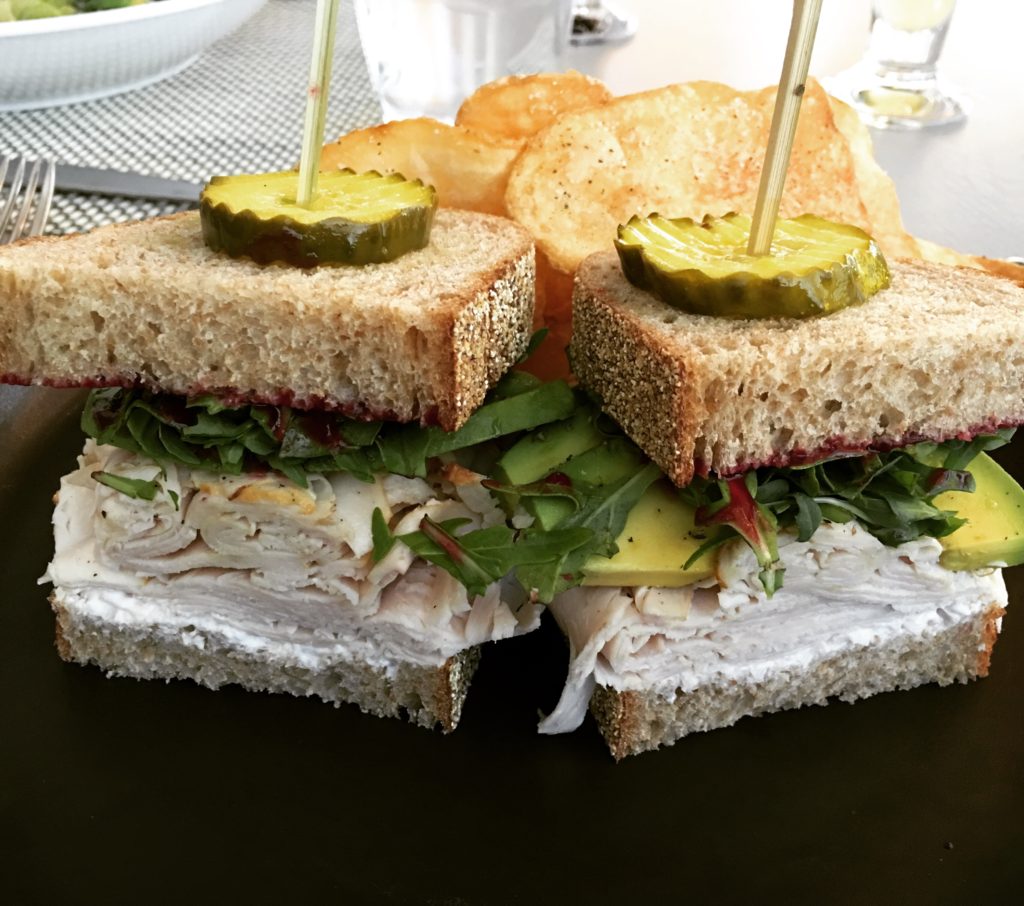 Roasted Organic Turkey sandwich with avocado, arugula, cranberry jam and horseradish 