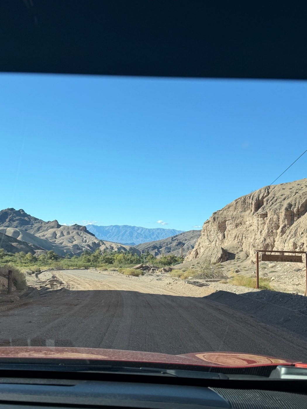 The dirt road into China Ranch, winding down through the canyon toward the Amargosa River.